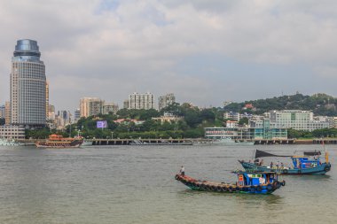 Xiamen skyline and Chinese fishing boats clipart