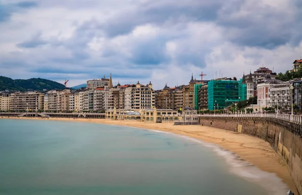 Panorama of La Concha bay and beach in San Sebastian Donostia with the city coastline and waterfront hotels, the Basque Country, Spain, long exposure
