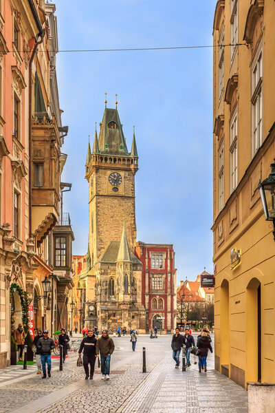 January 15, 2015 - Prague, Czech Republic: The Old Town Square with Old Town Hall Clock Tower in the center and people walking in the street in Prague, Czech Republic