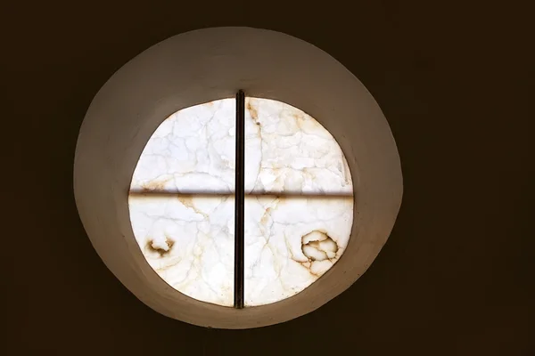 Alabaster round window with cross difussed light — Stock Photo, Image