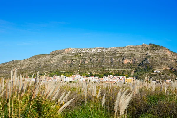 Cullera mountain with white sign writted on in — Stock Photo, Image