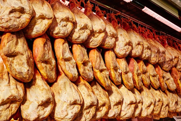 Jamon serrano ham from Spain whole in a row — Stock Photo, Image