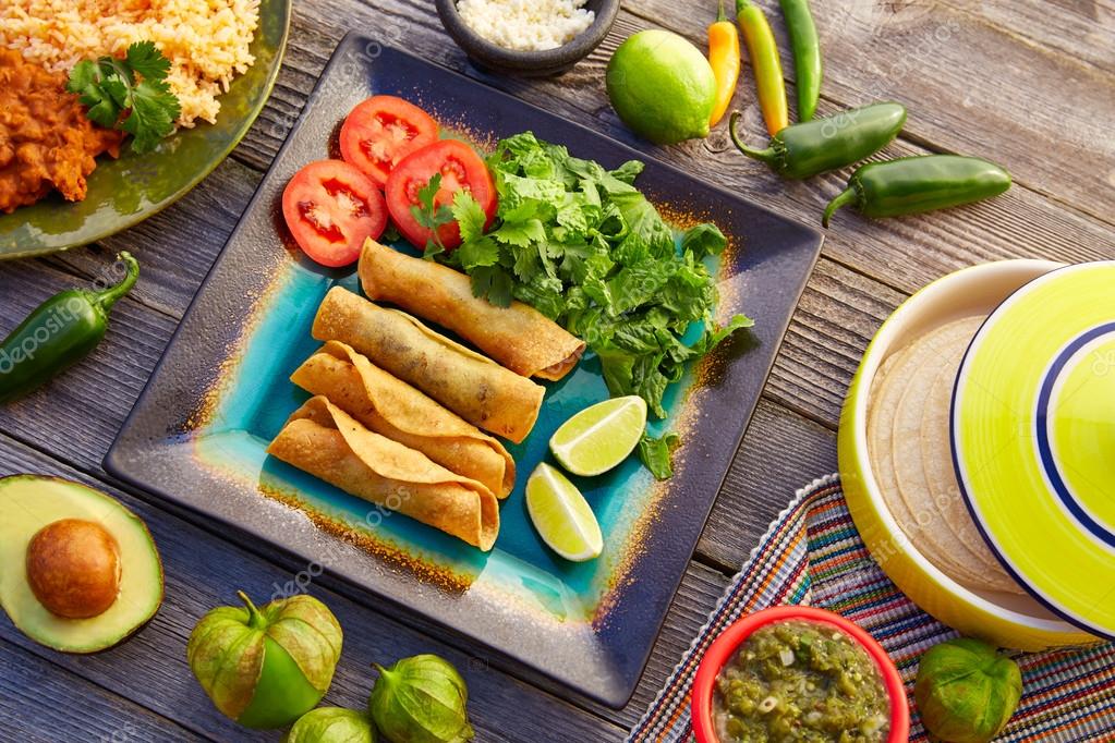 Mexican flautas rolled tacos with salsa Stock Photo by ©lunamarina