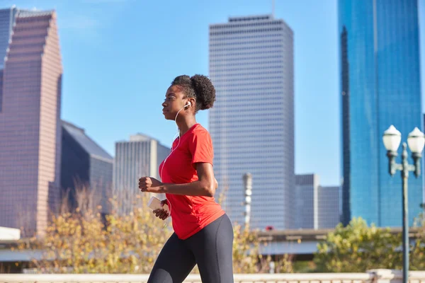 Runner girl running listening music earphones — Stock Photo, Image