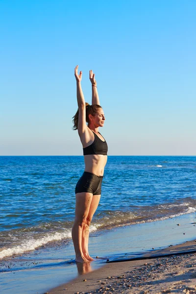 Pilates yoga workout exercise outdoor on beach — Stock Photo, Image