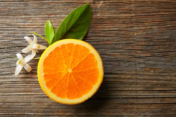 Cut open orange fruit with orange flower