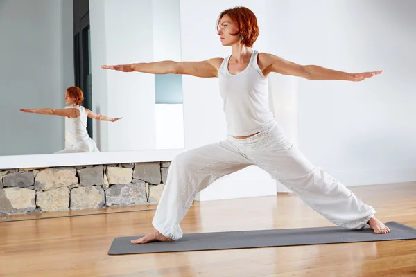 Yoga Warrior two II pose in wooden floor — Stock Photo, Image