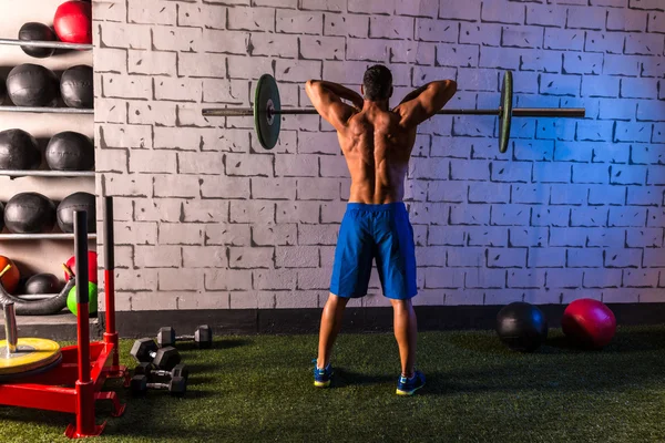 Barbell weight lifting man rear view workout gym — Stock Photo, Image