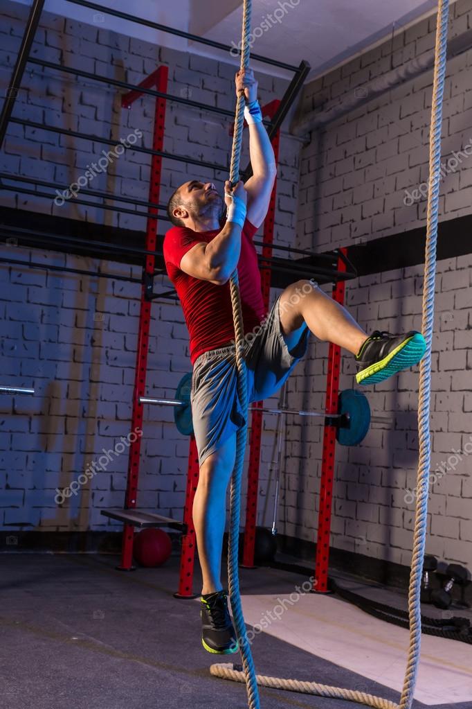 https://st2.depositphotos.com/1053932/5608/i/950/depositphotos_56089627-stock-photo-climb-rope-exercise-man-at.jpg