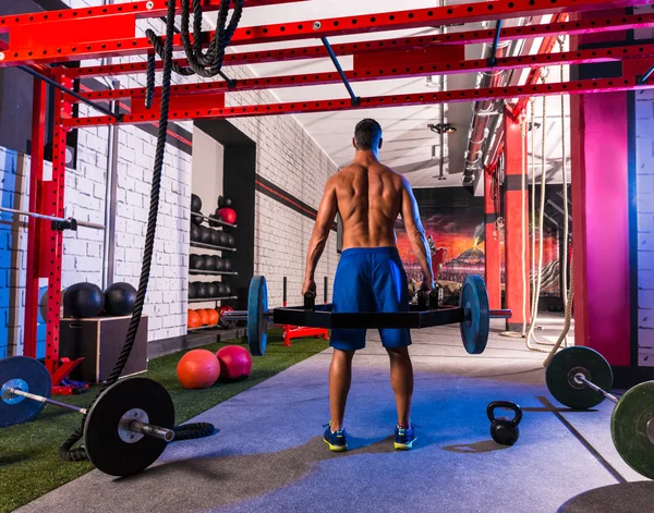 Hex dead lift achselzuckend bar deadlifts man at gym — Stockfoto