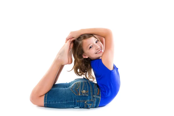 Flexible contortionist kid girl playing on white — Stock Photo, Image