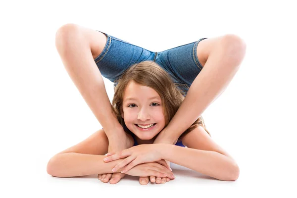 Flexible contortionist kid girl playing on white — Stock Photo, Image