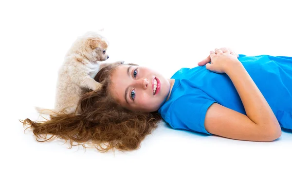 Relaxed kid girl and puppy chihuahua dog lying Royalty Free Stock Images