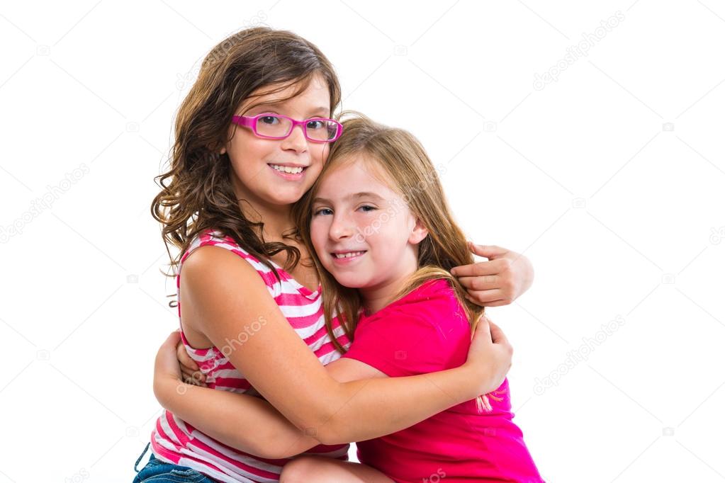 kid girls tender hug smiling ans friends cousins