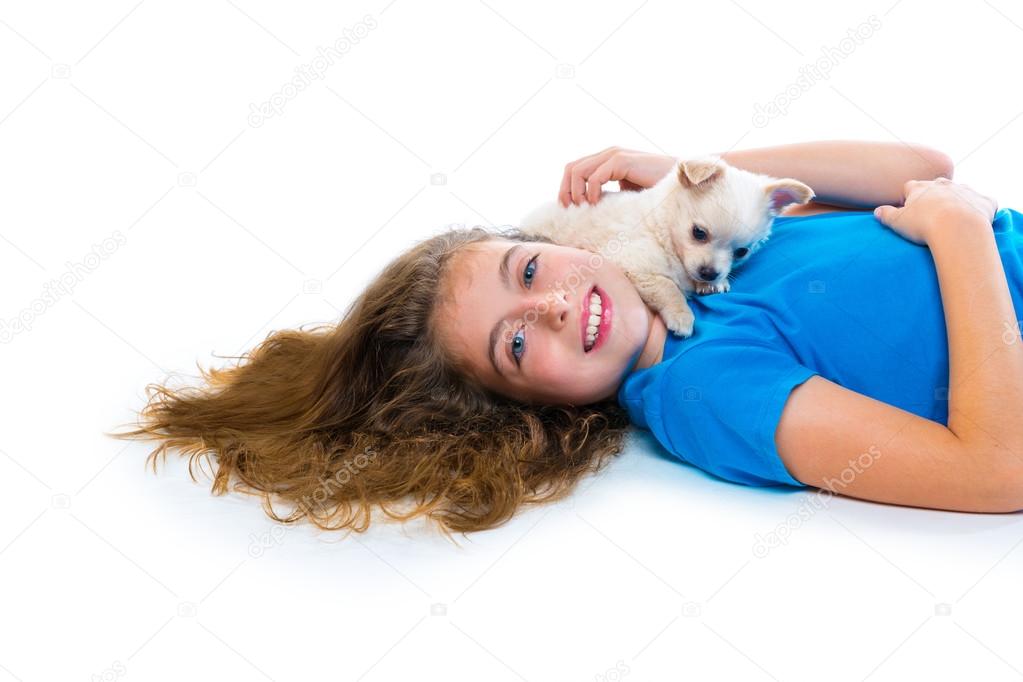 relaxed kid girl and puppy chihuahua dog lying