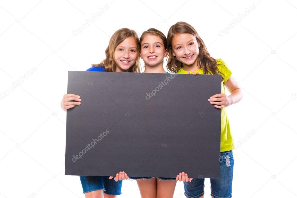 happy kid girls holding black board copyspace
