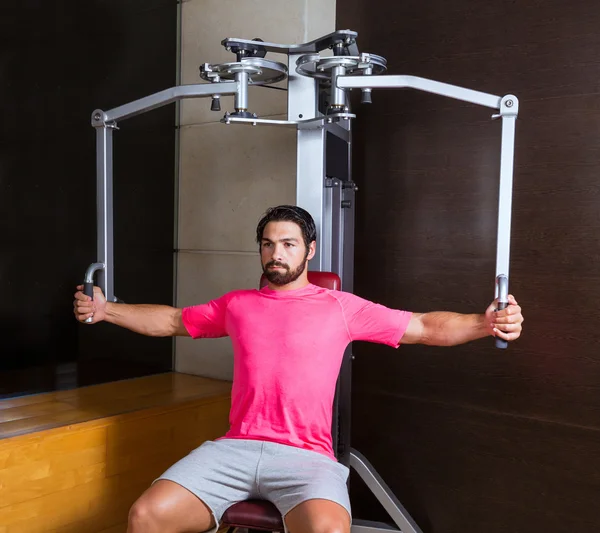 Man doing pec dec fly exercise