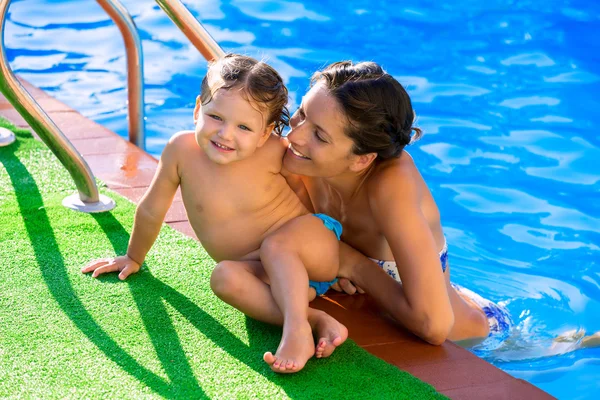 Happy mother and baby daughter swimming pool Royalty Free Stock Images