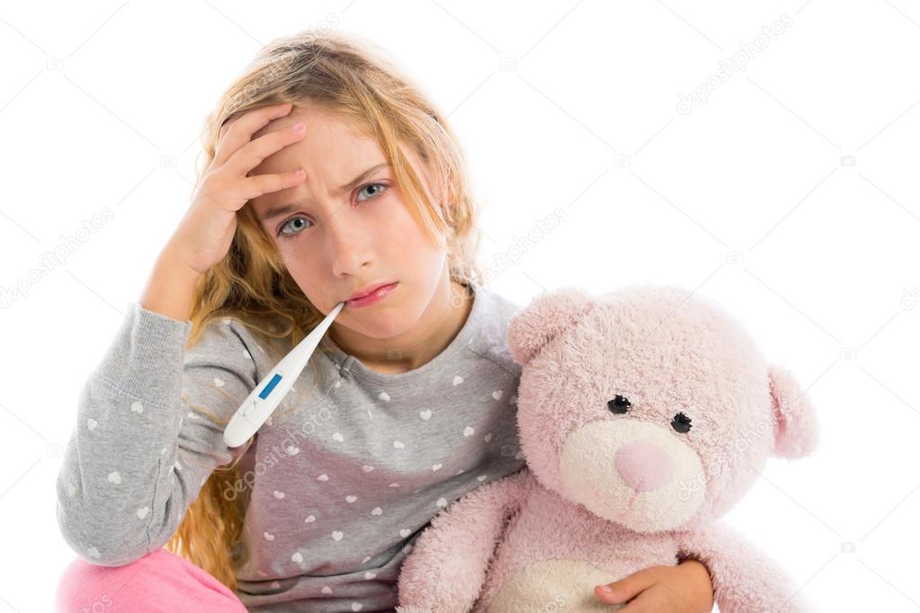 blond girl with thermometer and flu cold in pyjama