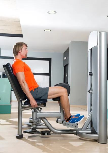 Hip abduction blond man exercise at gym closing — Stock Photo, Image