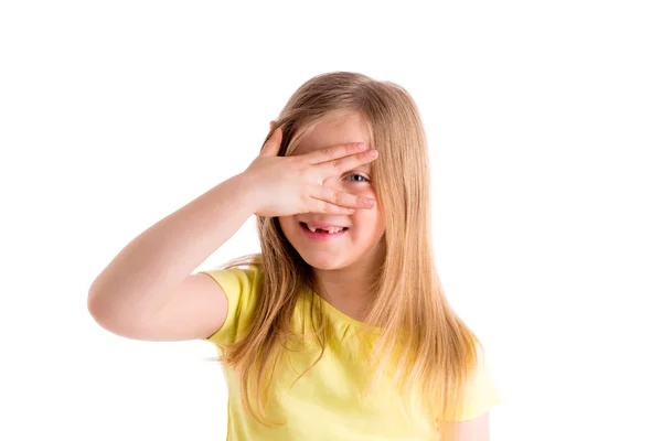 Blond indented kid girl hiding eyes with fingers — Stock Photo, Image