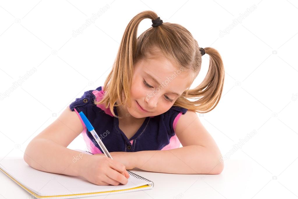 Blond kid girl student with spiral notebook in desk