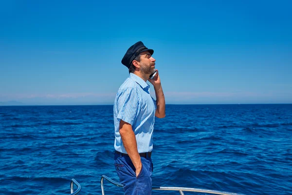 Captain cap sailor man talking mobile phone boat — Stock Photo, Image