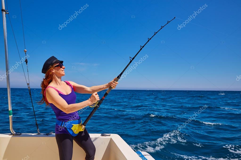 Beautiful woman girl fishing rod trolling in boat — Stock Photo