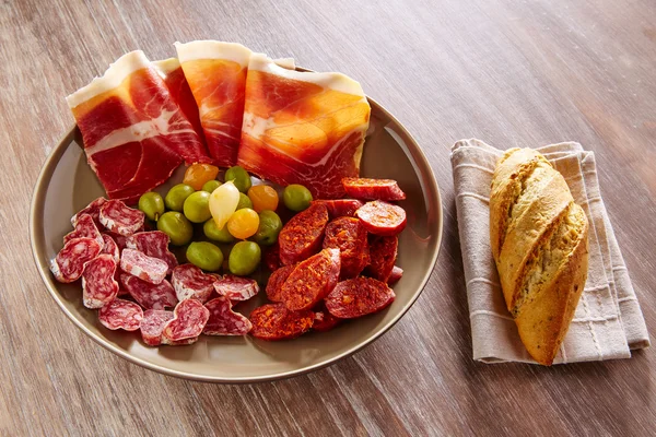 Tapas of Spain with ham bread olives sausages — Stock Photo, Image