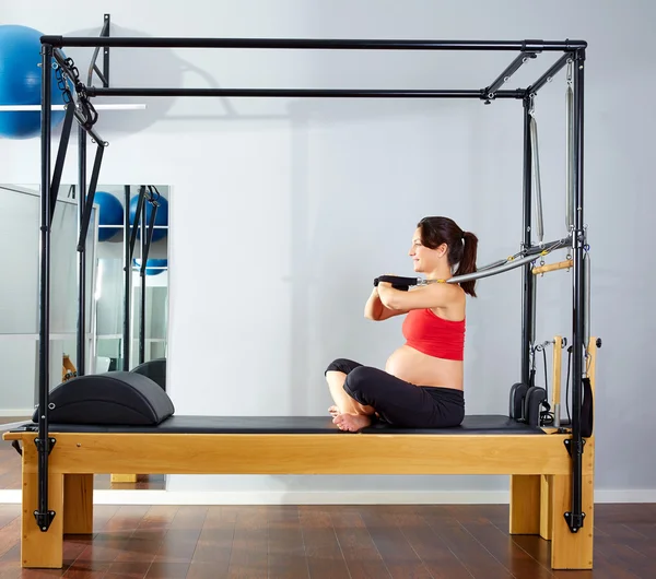 Pregnant woman pilates reformer arms exercise — Stock Photo, Image