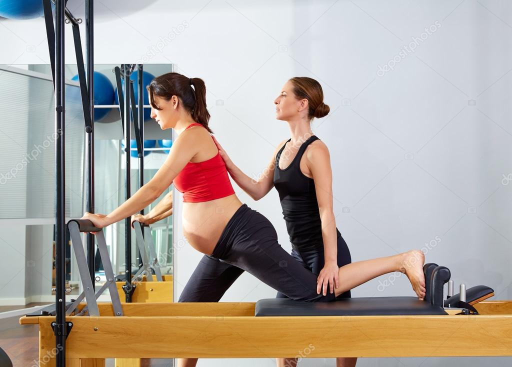 pregnant woman pilates reformer cadillac exercise