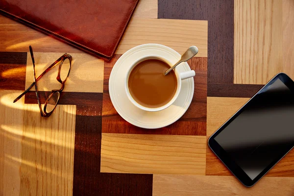 Coffee cup with glasses and tablet pc — Stock Photo, Image