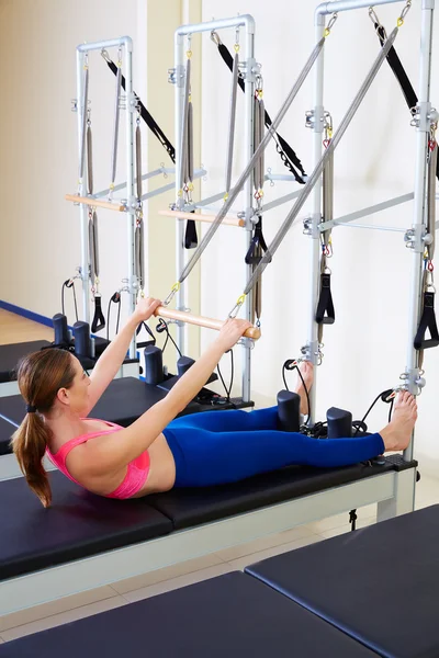 Pilates reformer woman roll up exercise — Zdjęcie stockowe