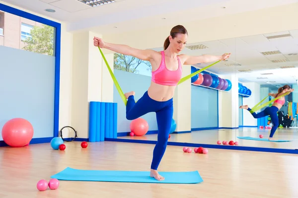 Pilates woman standing rubber band exercise — Φωτογραφία Αρχείου