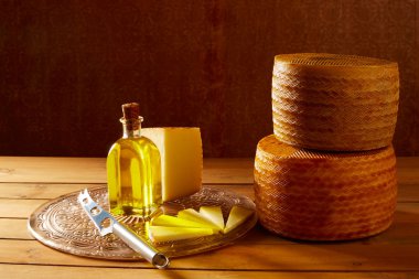 Manchego cheese from Spain in wooden table clipart