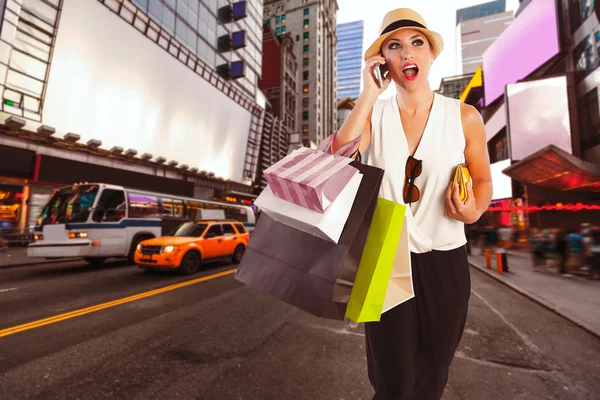 Blond girl shopaholic talking phone Times Square — Stock Photo, Image