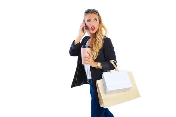 Blond shopaholic woman bags and smartphone — Stock Photo, Image