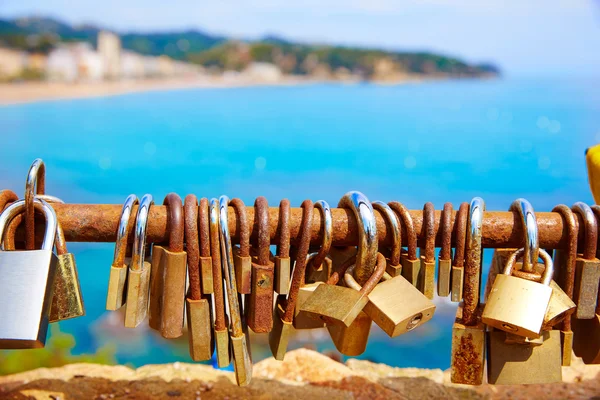 Costa Brava beach Lloret de Mar padlocks in a row — Stock Photo, Image