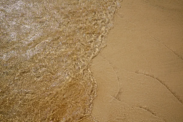 Spiaggia acqua e sabbia texture sfondo — Foto Stock