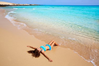 Girl on the beach Fuerteventura at Canary Islands  clipart