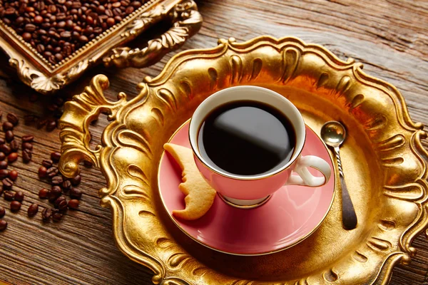 Coffee cup and beans on vintage golden tray — Stock Photo, Image