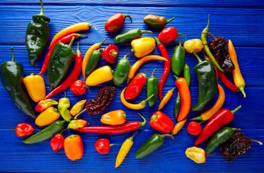 Mexican hot chili peppers colorful mix clipart