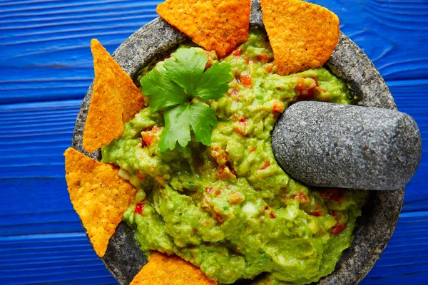 Guacamole with nachos in Mexican molcajete