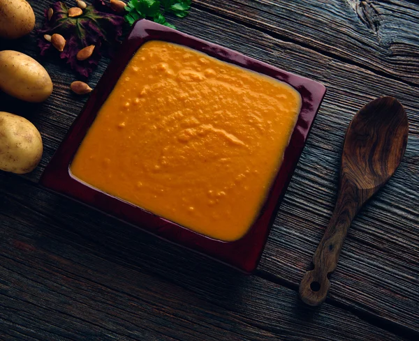 Pumpkin soup cream on wood — Stock Photo, Image