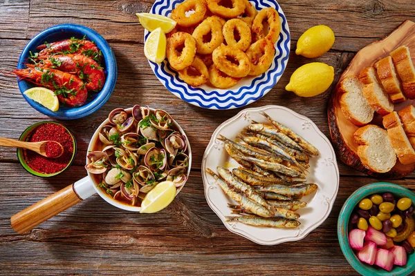 Tapas clams shrimps calamari fried anchovies — Stock Photo, Image