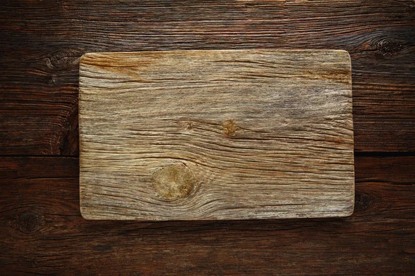 Aged wood cutting board as a copyspace — Stock Photo, Image