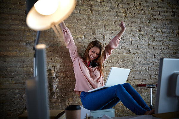 Excited happy woman at office open arms