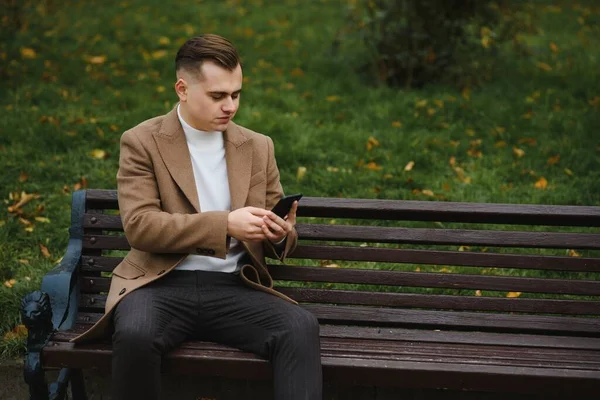 Stylish elegant men man in coat in urban style