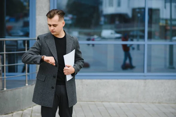 Stylish elegant men man in coat in urban style