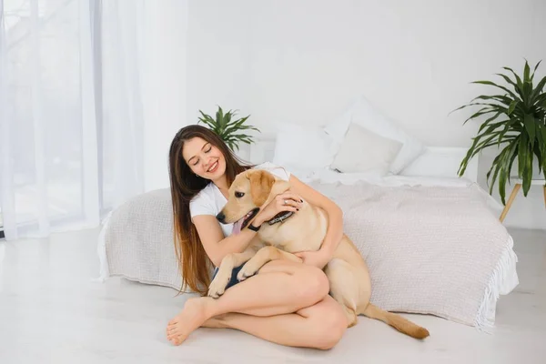 Woman and her dog in the house